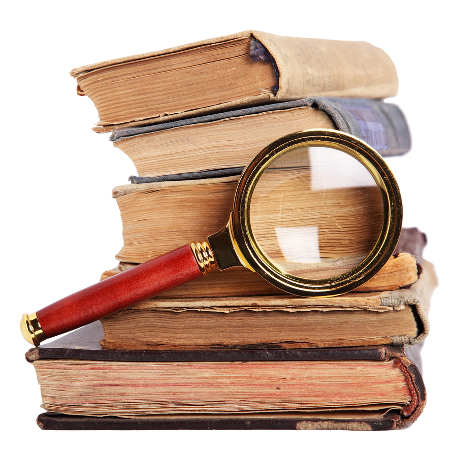 bigstock-Stack-Of-Books-And-Magnifying-6753013.jp_.jpg